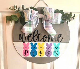 A handmade Easter welcome sign hanging on a door