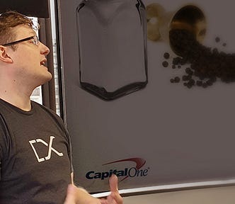 Man in a DevExchange shirt giving a presentation.