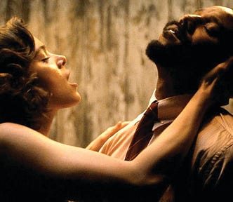 A woman, Mary, and a man, Stack, embrace.