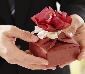 The writer pictures a small gift-wrapped box.