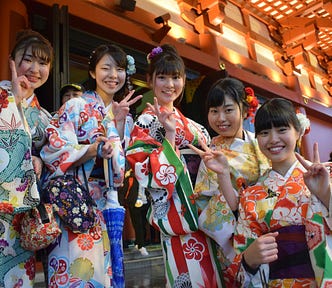 Japanese girls in traditional costumes.