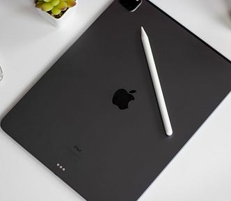 iPad Pro with Apple Pencil and iPhone 15 Pro Max