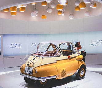 photo of a car in a museum setting. Photo by Nastya Dulhiier, Unsplash