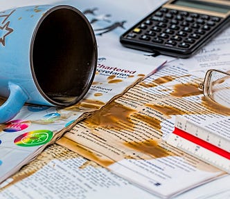 Coffee spilled on papers