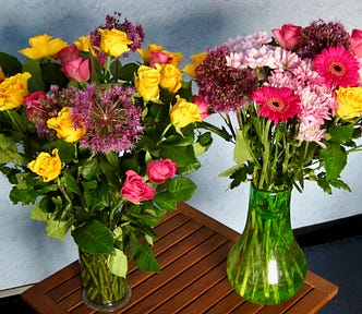 Two vases of colourful flowers