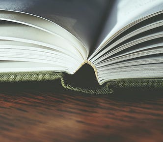 Book lying open on table
