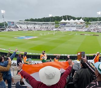 Indian cricket fans watch a test match