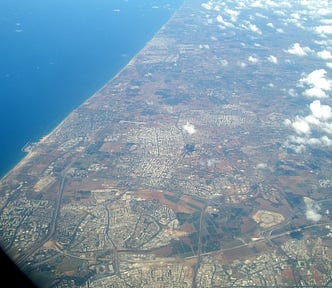 Coast of Palestine from the air, above Yafa looking north all the way to Haifa (Photo by Ramsey Hanhan, 2005)