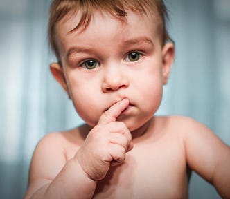 A picture of a baby putting his finger on his lips in deep thought. It depicts how you are deep in thought about where to send your story until I come with the all-knowing wisdom to guide you.