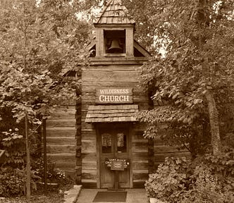 A photo of a wooden church in Ozark