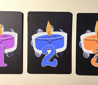 Three tarot and oracle pick a card piles with candles on them