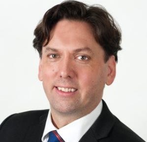 Head and shoulders portrait of Chris Day, Director of Engagement, CQC