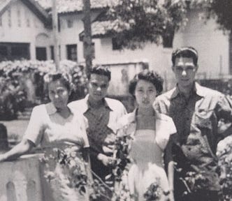 A family whose house was looted by Indonesian men during the conflict.