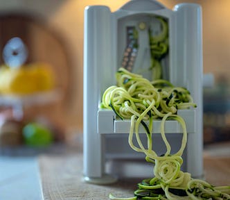Zucchini Shoestring Spaghetti front view of a Paderno 3-blade Tabletop Spiralizer | photography | ©pockett dessert