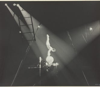 Antique B&W photo of acrobat balancing on a ball (chiasmus spices up your prose)