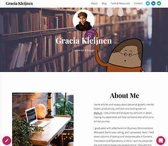 Screenshot of author’s Journo Portfolio writer’s website showing a top banner of a library, a circular headshot in the middle. Below that two content sections. On the left a desk with a laptop, on the right an “About Me” section.