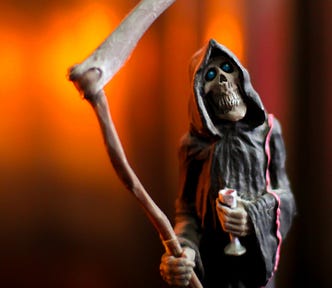 A statue of death is moving towards you, with the color of fire in the background.