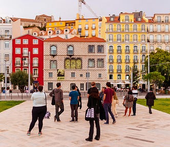 Group of people in a square in Lisbon.