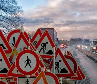 A large collection of road working signs.