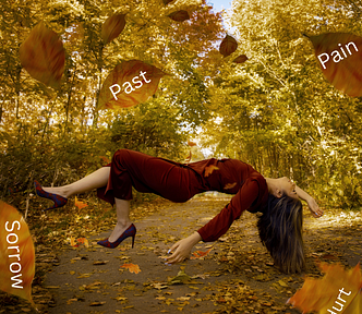 A lady levitating above ground among autumn leaves.