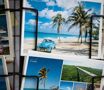 Postcards of exotic holiday destinations displayed on a rotating carousel