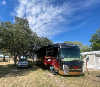 This is a photo of our motorhome and car on our new site in Smithville, Texas.