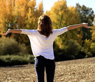 A Woman With Her Arms Outwards in the Fall. Release Letters by Harlow Journey