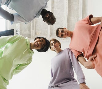 Four dudes looking down at you