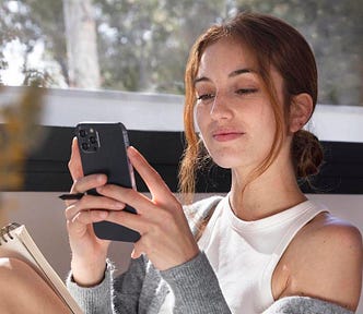Young woman looking at phone