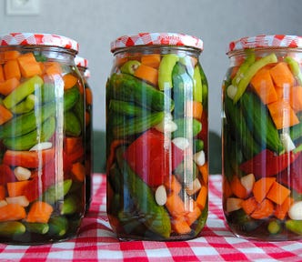 Three mixed pickle jars