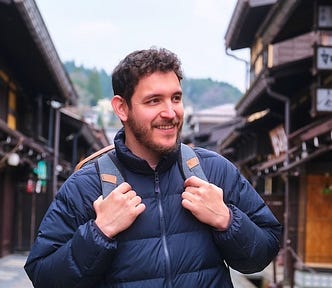 A tourist in Hida-Takayama is happy that he left his suitcase in a coin locker so that he can more freely more around the historic town.