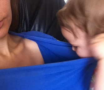 The author with her 16 month old daughter, who’s pulling at her shirt looking for breast milk