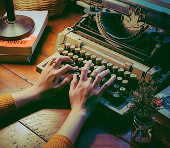 person using typewriter
