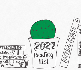 A bookshelf with books and a cactus