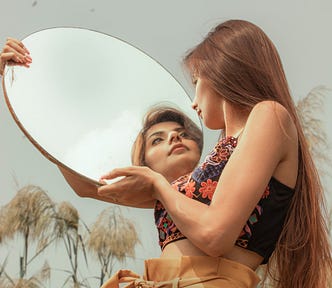 woman holding a mirror