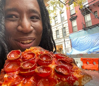 Scarlet eating Prince Street Pizza!