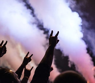 devil horns and a metal concert