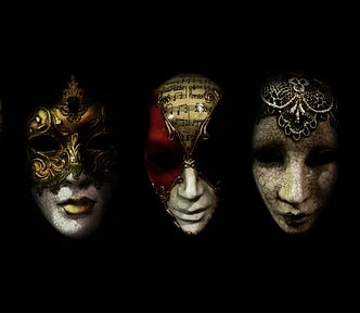 5 Venetian masks in a row in front of a black backdrop