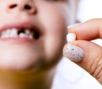 The tooth fairy is as real as the easter bunny. Photo by burmistrovaiuliia.