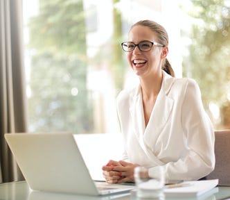 Woman with laptop smiling