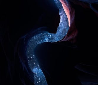 A curvy sliver of brilliant, star-filled sky, going from the top to the bottom of the image, as photographed looking up from the bottom of a deep crevasse of time-hewn red rock that is mostly in black shadow, so only pinkish slivers of red show on parts of the curves.