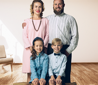 traditional family, husband wife, 2 kids — girl and boy — standing in a living room