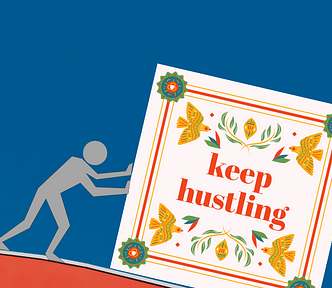 A person pushing a carton decorated with words — Keep hustling