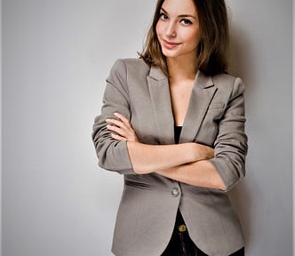 confident girl with brown hair arms crossed over chest