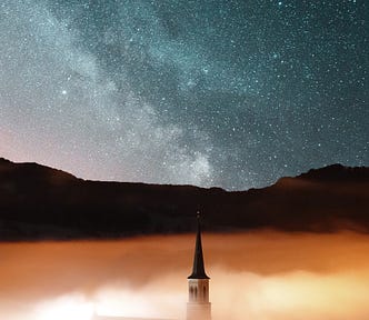 A church in the fog under a starry sky