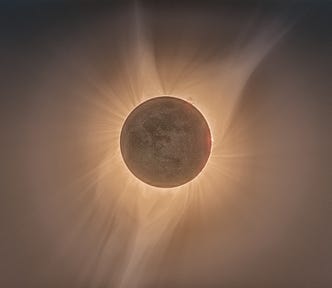 A photo of a total solar eclipse, with visible penumbra and solar corona