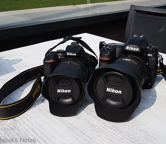 An image showing two Nikon cameras, one mine, the other my husband’s.