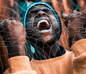 A man grabs a fishnet with both hands and screaming.