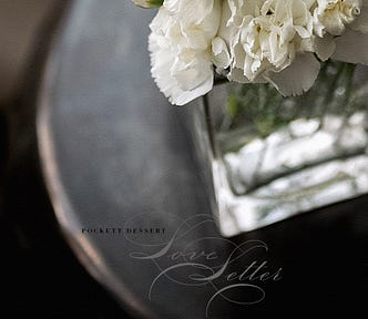 Spiritual darkness, white flowers in a vase with the words Love Letter | © pockett dessert