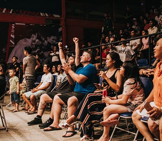 Crowd of people looking amped up! They’re excited to be here! They look like how I want my readers to feel when they read my content.
